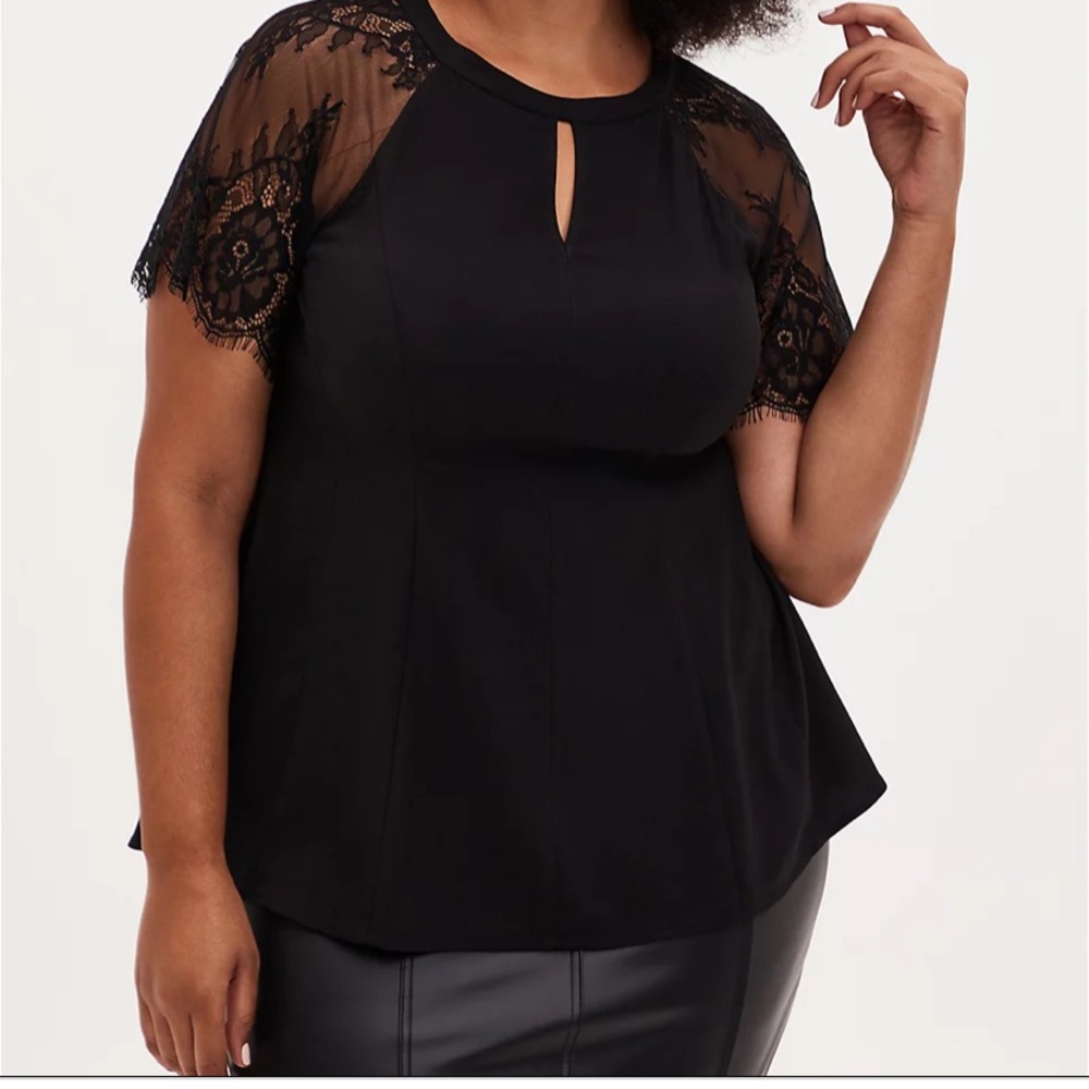 Torrid fit and flare black top with lace sleeves and key hole!